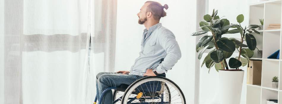 Man In Wheelchair At Home